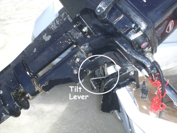 The Dinghy outboard tilts up and clips in with the tilt lever.