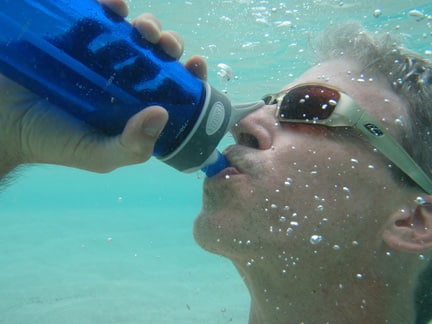 Michael drinking underwater at Sandy Spit BVI