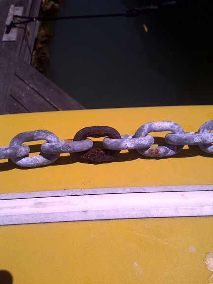 Rusted chain link on anchor rode