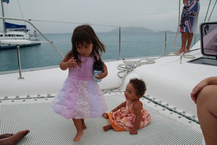 The girls on the Catamaran trampoline in Cane Garden Bay